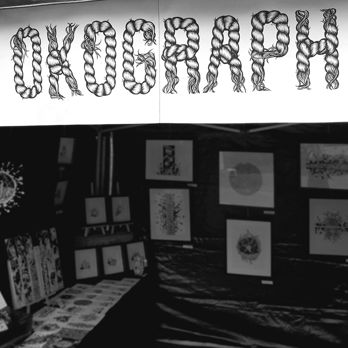 Photo du stand d'exposition de l'artiste Okograph au marché de créateurs Artisames en 2017